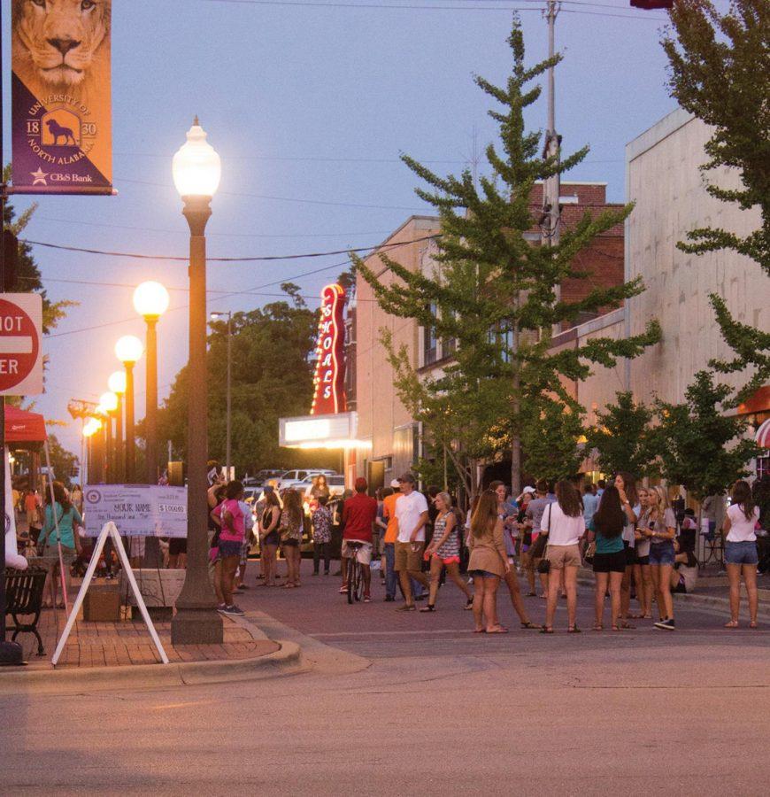 Students gather on Mobile Street during Lion Night 2014. The event introduces students to downtown businesses. “It’s not only great that we get to become familiar with the city and all it has to offer, but we also have a chance to meet other students,” said SGA President Nick Lang.