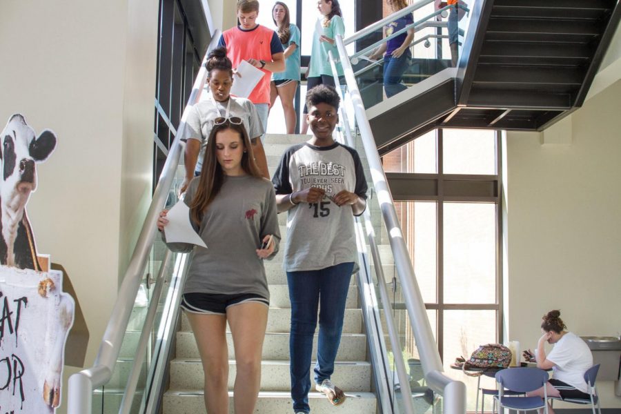 A group of students leaves their class in the Commons Building. Stairs have been a struggle for UNA students for many years.