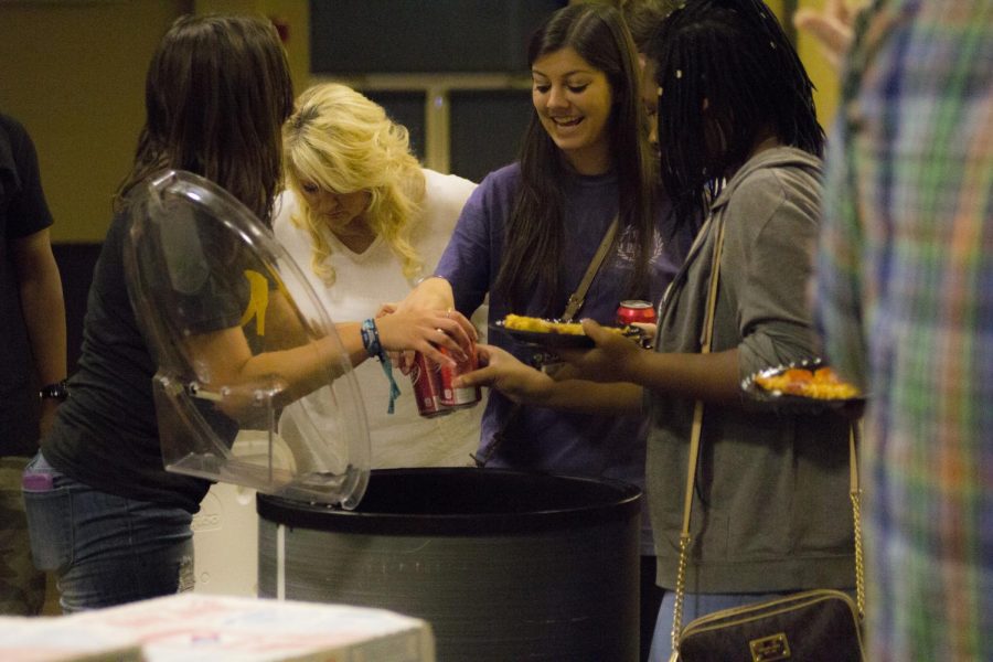 UPC Pro Tempore Amanda Areostatico (left) hands out soft drinks at the first Movie Mondays event featuring “Inside Out” Sept. 21. About 220 students attended the event.