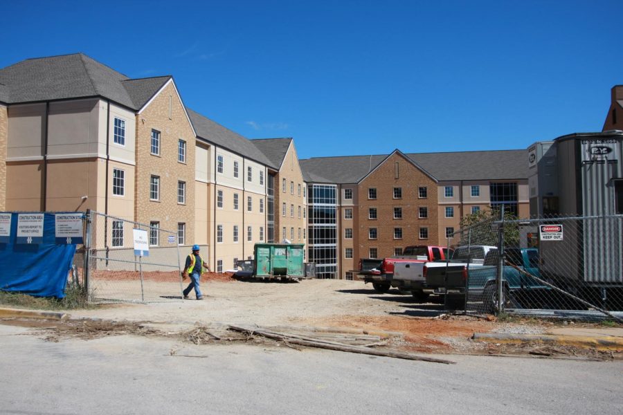 Construction workers complete final details on Olive Hall behind the Student Recreation Center. Director of University Residences Kevin Jacques said freshman students currently living in Rivers Hall will move into Olive Hall before the spring semester begins in January.