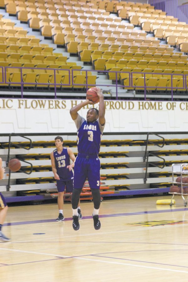 UNA junior guard Jeff Hodge takes a jumpshot in a preseason practice for men’s basketball. The Lions return three players from last year, including Hodge.