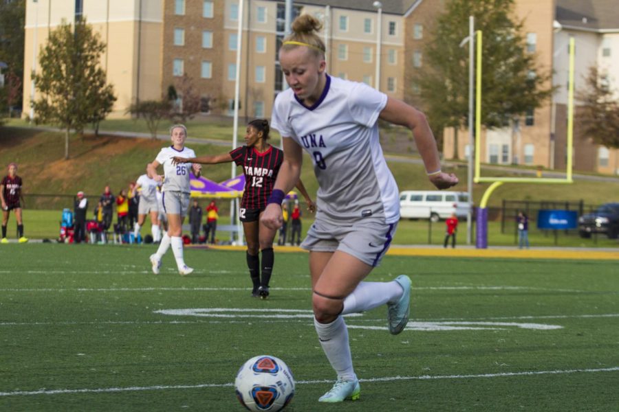 Junior midfielder Stacey Webber sprints with the ball during UNA’s second-round playoff game against the University of Tampa Nov. 15. The Spartans eliminated the Lions, scoring with two seconds left in the game.