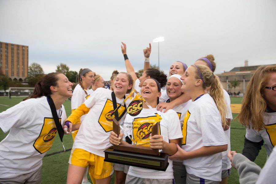 The UNA women’s soccer team celebrates with the Gulf South Conference Championship trophy Nov. 8. The team won the GSC Championship game for the first time since 2011.
