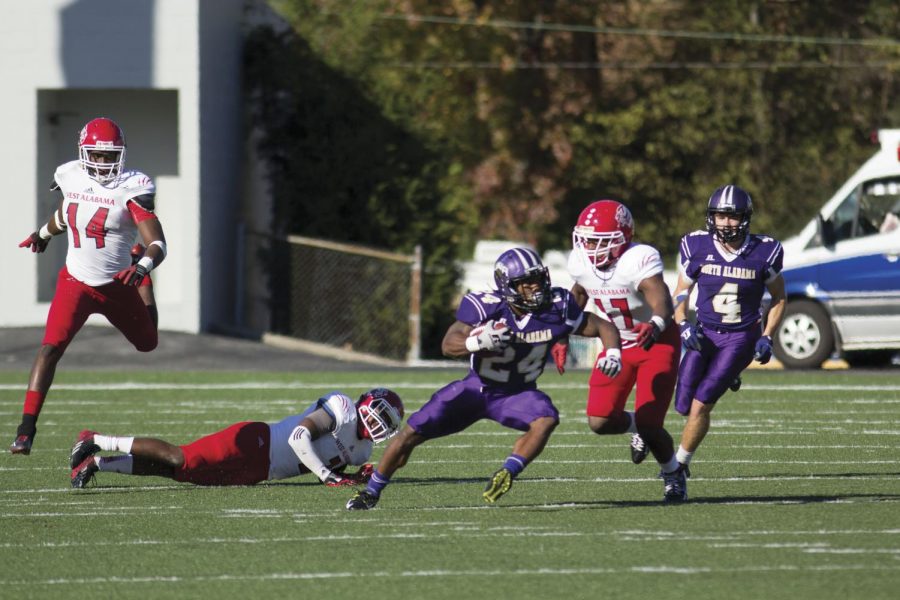 Senior running back Lamonte Thompson (24) weaves through defenders during UNA’s 52-14 victory over West Alabama on Preview Day Nov 14. The Lions won their third straight Gulf South Conference championship and will host Newberry in the first round of the playoffs Nov. 21.