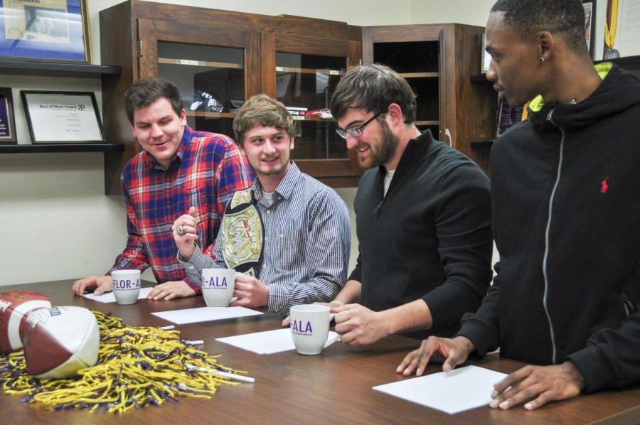 (From left to right): James Dubuisson, Mike Ezekiel, Kadin Pounders and Xavier Wherry debate the College Football Playoff Nov. 30. Pounders, who plans to graduate May 2016, spent numerous hours and multiple years with The Flor-Ala.