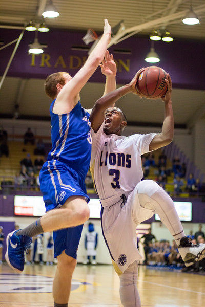 Junior guard Jeff Hodge draws contact during a shot against Alabama-Huntsville Jan. 16. The Lions defeated their rival in a high-scoring 119-103 shootout.