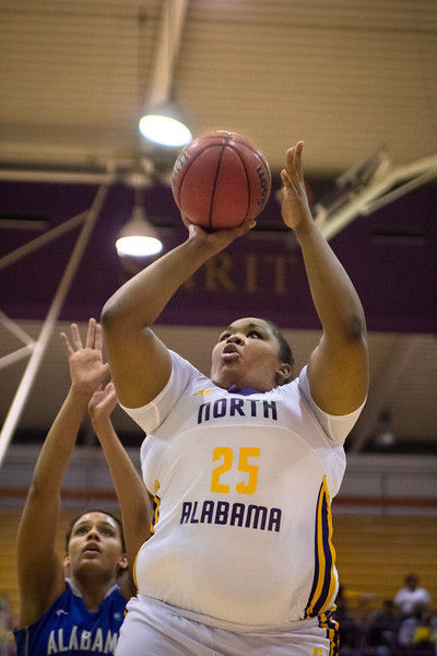 UNAs senior transfer center Alexus Patterson goes up for a shot against Alabama-Huntsville Jan. 16. The Lions fell short in the last minutes, losing 63-55.