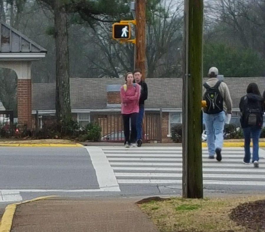Students cross the intersection of Pine and Irvine streets. The UNA Police Department placed a “no turn on red” sign at the intersection earlier this month after a driver nearly hit a pedestrian, officials said.