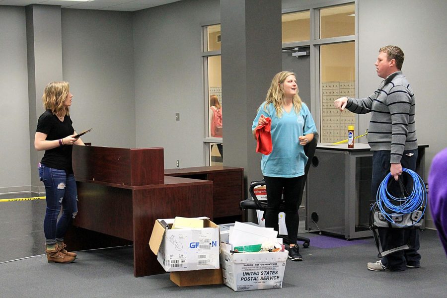 Students (from left to right) Kayla Land, Hailey Holke and Kyle McCafferty unpack items in the new Student Engagement Office April 8. Both Student Engagement and Student Government Association are moving into the old on-campus bookstore in the Guillot University Center.