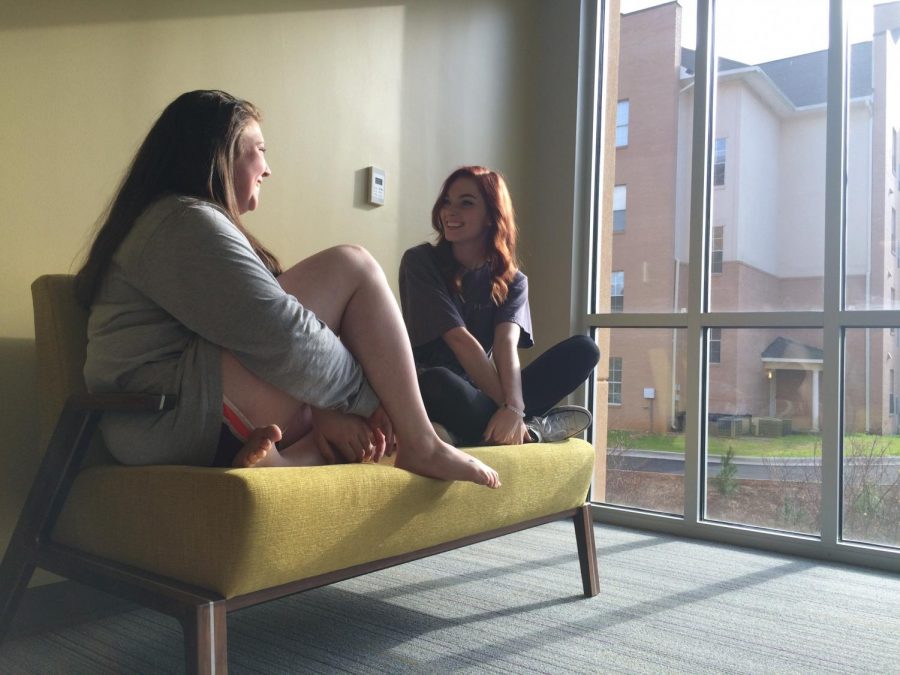 Two students visit in one of the new residence halls. Mattielou Hall and Olive Hall offer many amenities for freshman students.