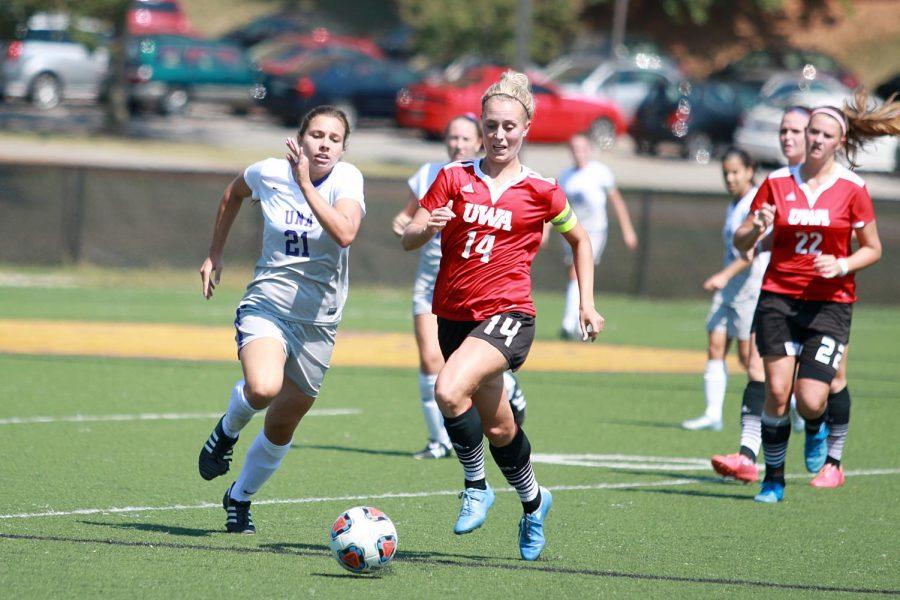 Sophomore midfielder Margarida Sousa (left) chases the ball during a match against rival West Alabama Sept. 25. UNA lost to the Tigers 3-1 and fall to 2-2 in conference play.