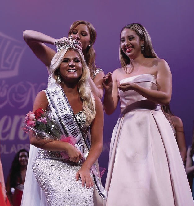 Morgan Ann Mathis receives her national title and crown from Americas National Teenager Scholarship Organization in July. She represented her home state, Tennessee.
