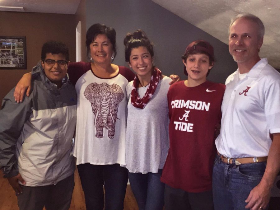 Sophomore Riley Gann (middle) and her parents and brother pose with sophomore Abdualwahab Aljohani (far left) for a photo during their 2015 Thanksgiving celebrations. Gann invited Aljohani, who is an international student from Saudi Arabia, to her house for the holiday. 