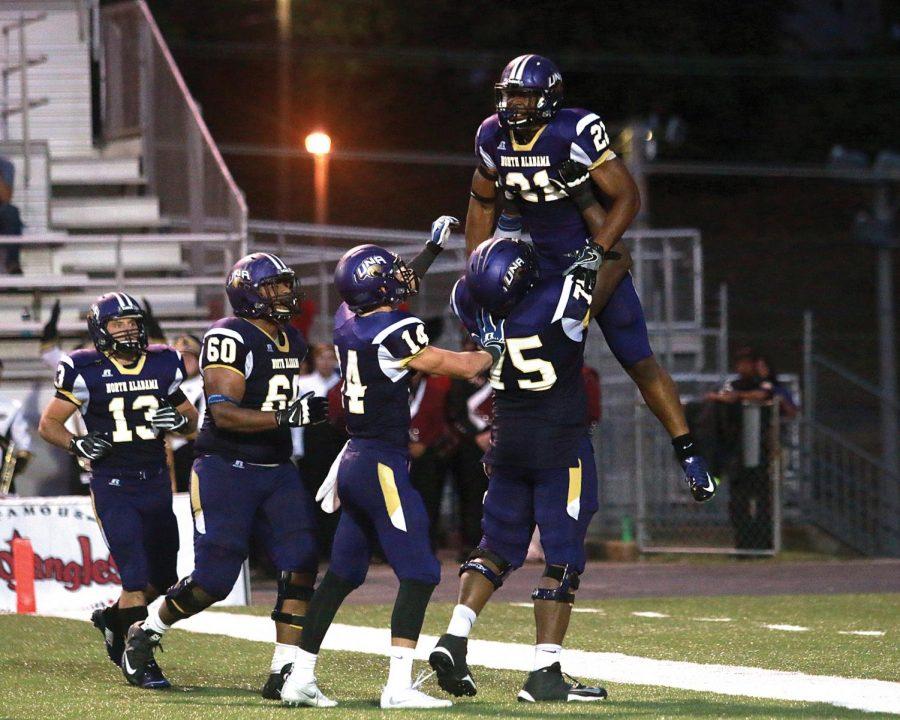 Lions offensive players celebrate a Terence Humphrey touchdown against Valdosta State Sept. 17 in Florence. North Alabama looks to clinch a conference title with two games left.