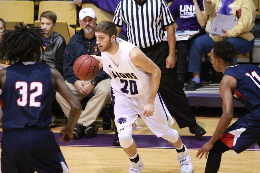 Senior forward Austin Timms looks to make a play on the basket in North Alabamas game versus Lane at Flowers Hall. The Lions dropped a heartbreaker to the Dragons in overtime to give UNA its first loss of the season.