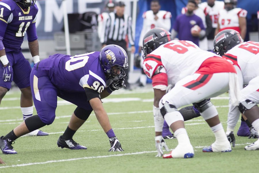 Redshirt sophomore Frank Williams prepares to rush the offensive line in a quarterfinal matchup against North Greenville in Braly Stadium Dec. 3. The Lions rolled to a 38-0 win and will advance to the semifinal round for the first time since 2008.