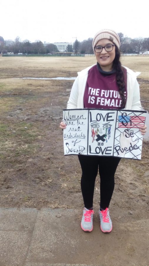 Junior Ashley Garcia stands with the sign she created for the Womens March in Washington D.C. It was really inspiring to be surrounded by many like-minded individuals because of dealing with all of the hateful rhetoric being spread around during the election,” she said.