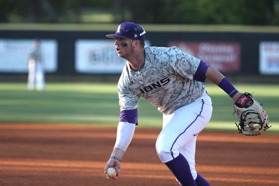 Lions junior infielder Kyle Hubbuch tosses the ball during a game against Trevecca Nazarene at Mike D. Lane Field April 4. Hubbuch hit a walk-off RBI single in the bottom of the ninth to give the Lions a 2-1 win over Montevallo. 