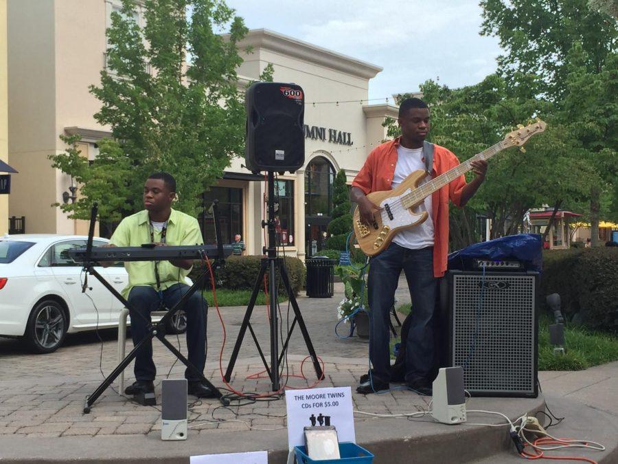 John III and Jeremiah Moore perform at Bridge Street Mall July 2016. The brothers make up musical duo Moore4More, who recently signed a production deal with Grammy-winning producer Jaee Logan.