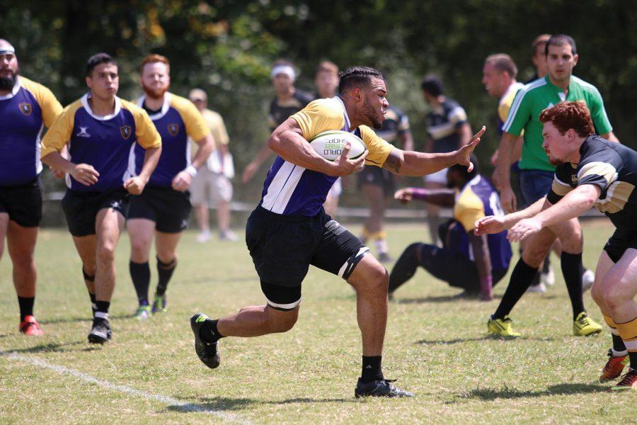 A North Alabama rugby player rushes toward the opponent in the Lions’ season-opening victory against Vanderbilt at Veterans Park Sept. 3, 2016. The Lions will play against Vanderbilt again in the upcoming weeks.