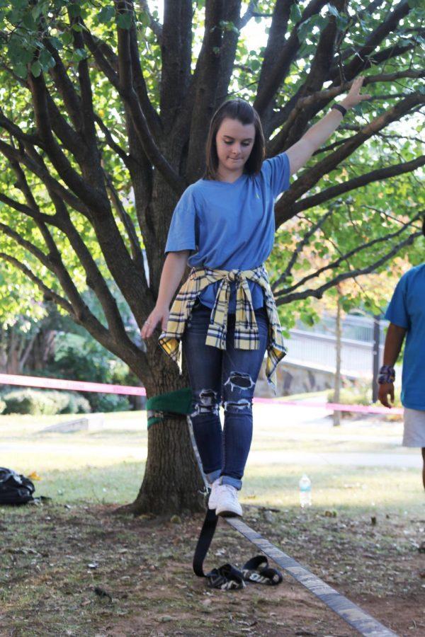 Junior Savannah Jones walks on a slackline during OAC’s “Camping on Campus” Sept. 7, 2016. Slacklining is one of the activities the OAC will be offering during the spring semester.