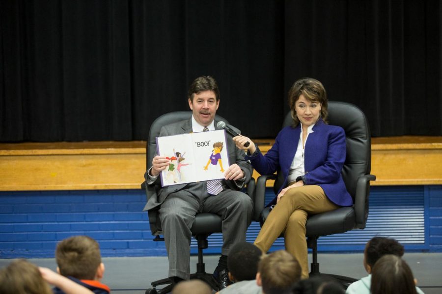 The Kitts family reads to a local school