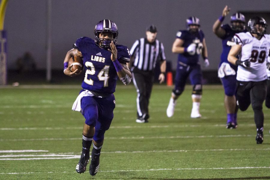 Damon Cox runs the ball towards the end zone. He helped lead UNA to victory with 99 rushing yards. 