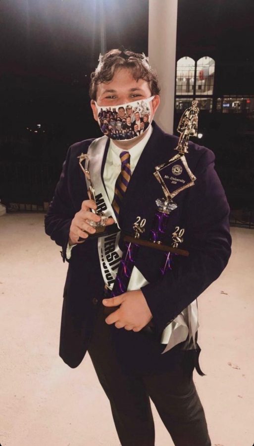 Gordon smiles as he accepts his awards of “Mr. University” and “Mr. Phi Mu.” He wears a mask featuring many of his best moments at UNA, including SOAR, LaGrange and SGA.