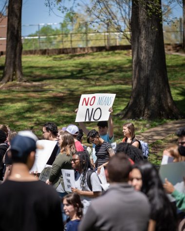 A student holds a sign that reads  “NO MEANS NO” at a protest the April 14 protest at Memorial Amphitheater.