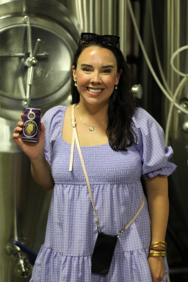 Singin’ River co-owner Michelle Jones poses with a can of newly released Golden Mane.