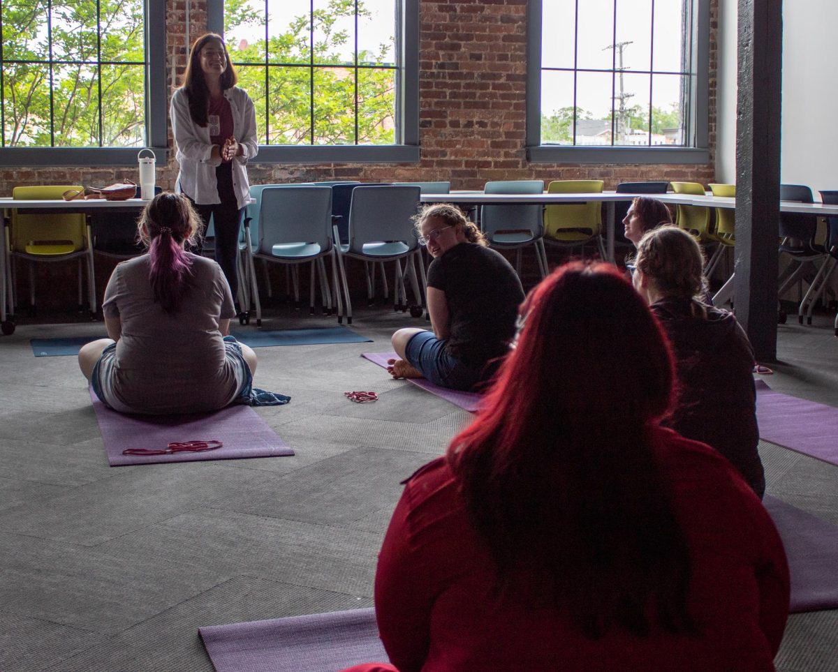 Yoga House instructor and co-owner Ashley Haselton teaches students.