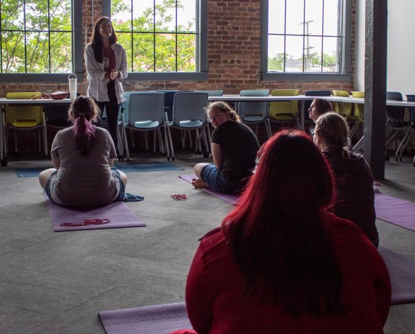 Yoga House instructor and co-owner Ashley Haselton teaches students.