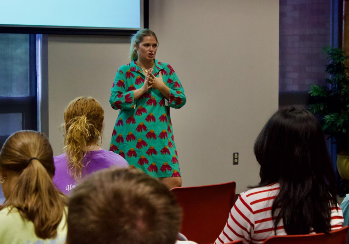 Alyson Bergner, the Associate Director of the Mitchell-West Center for Social Inclusion, speaks to the crowd about self-care.