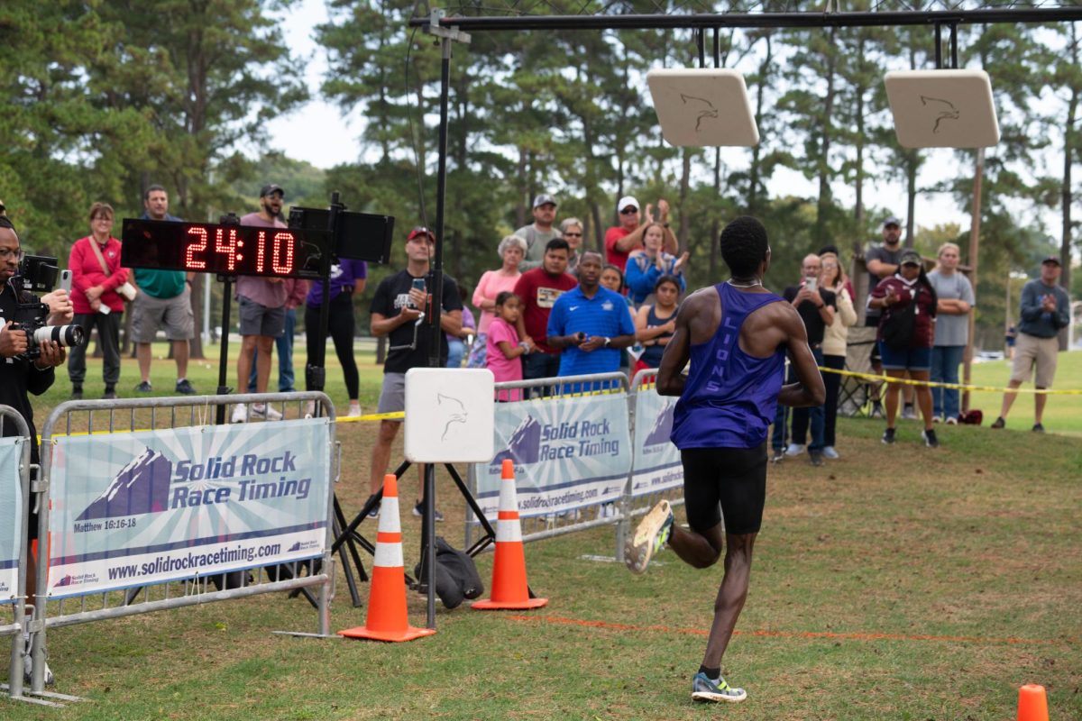 True freshman Kimeli Brian Bett nears the finish line at cross country meet. 