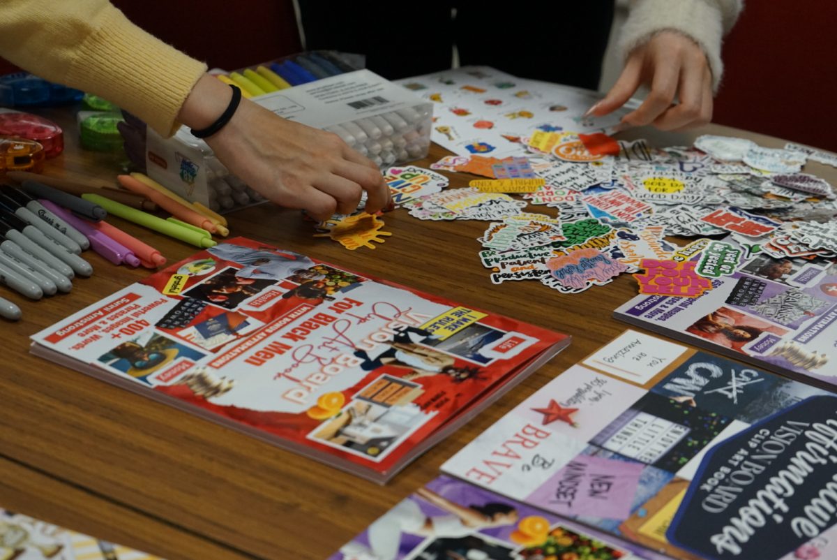 Students create 2025 vision boards with a variety of colorful and textured material. 