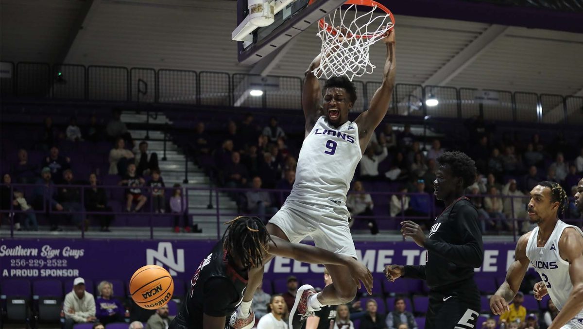 Taye Fields seen dunking on a defender in a recent game. 