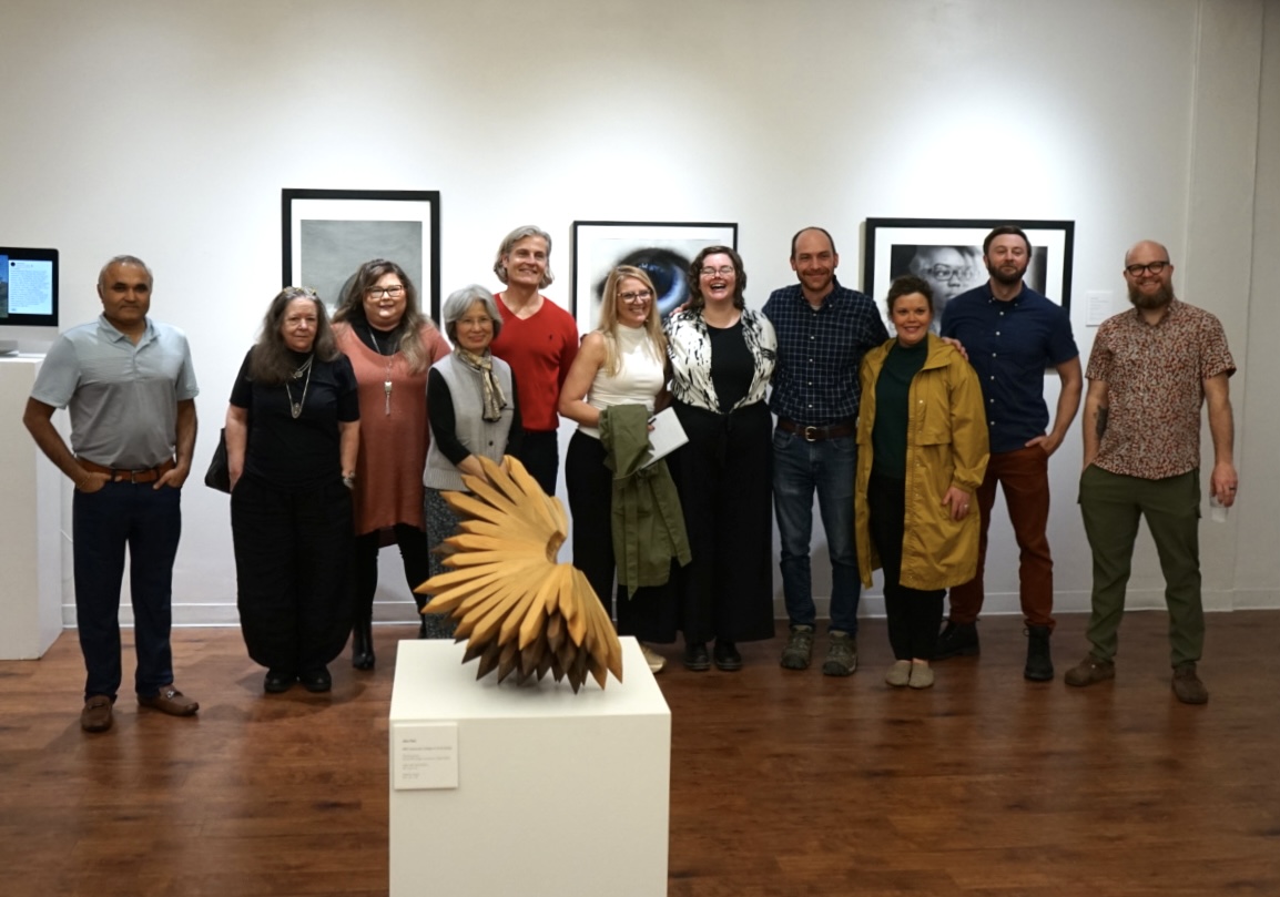 Department of Visual Arts faculty gathers at Faculty Exhibit.