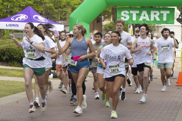 A group of students take off at the beginning of the race.