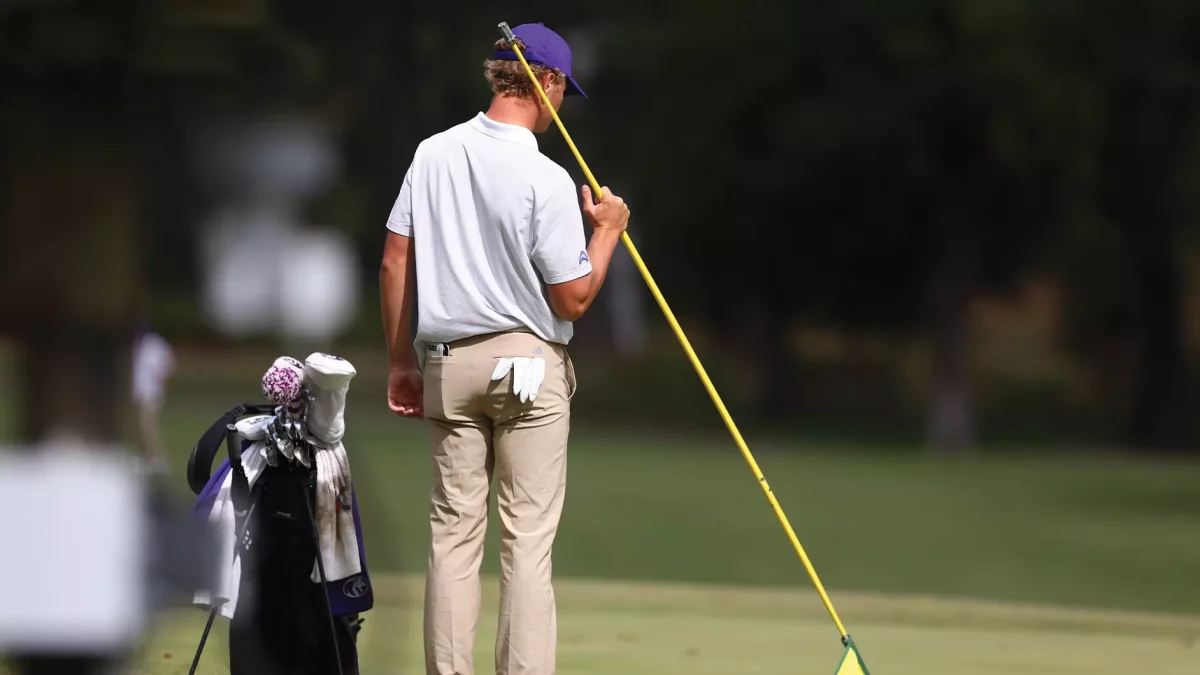 Andrew Ferworn judges the distance for his next swing.