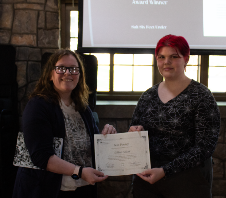 Submissions Editor Brooke Lunsford gives Mark Smith his Best Poetry award.